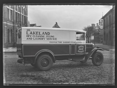 Lakeland dry cleaning lorry parked on cobbled street